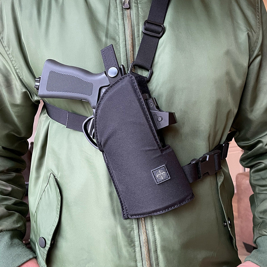 6 Needler Chest Holster holster worn on the front of a person's chest with gun in it